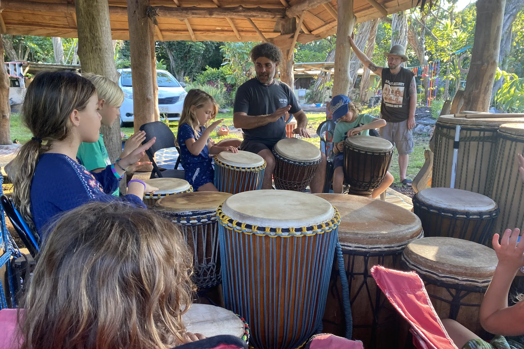 Community members sharing rhythm and practical learning in a workshop